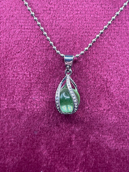 Uranium Glass Gemstone Inside a Spiral Silver Casing | Forming a Unique Vaseline Glass Pendant | It Glows Bright Green Under UV Light