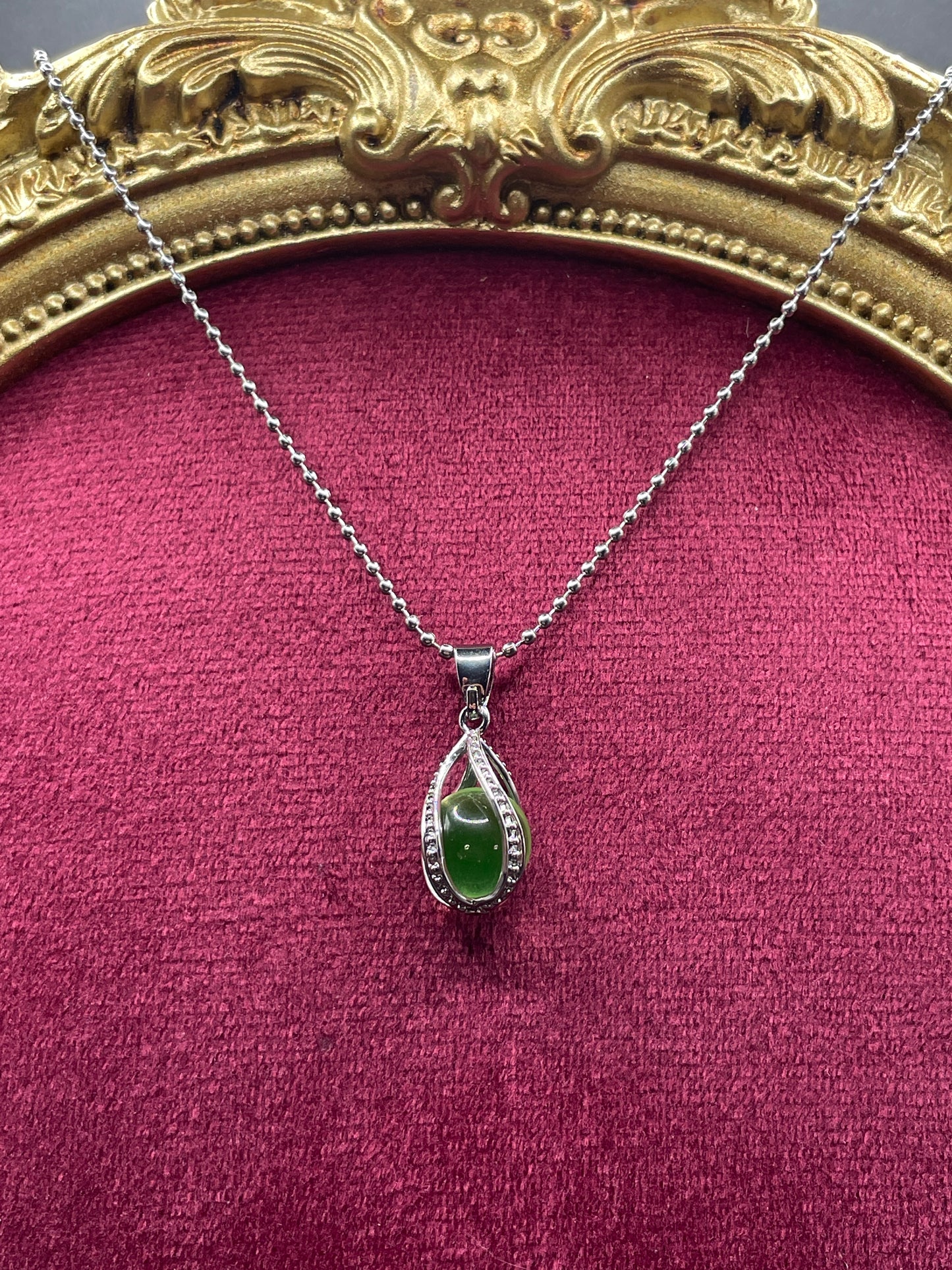 Uranium Glass Gemstone Inside a Spiral Silver Casing | Forming a Unique Vaseline Glass Pendant | It Glows Bright Green Under UV Light