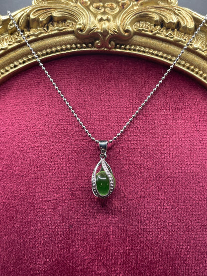 Uranium Glass Gemstone Inside a Spiral Silver Casing | Forming a Unique Vaseline Glass Pendant | It Glows Bright Green Under UV Light